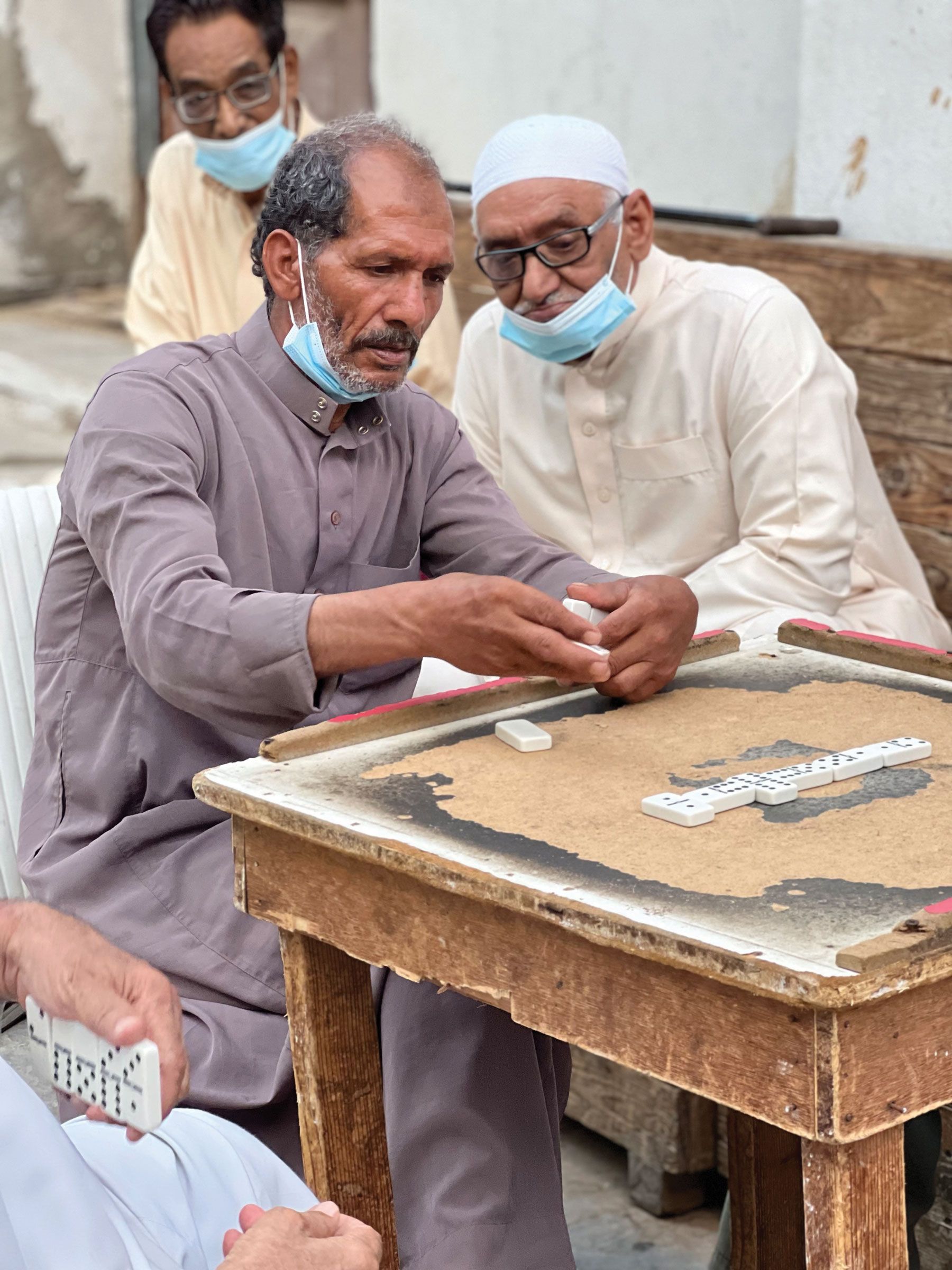 Men playing dominoes in the Old Town of Jeddah. (Photo by Joshua Bush)