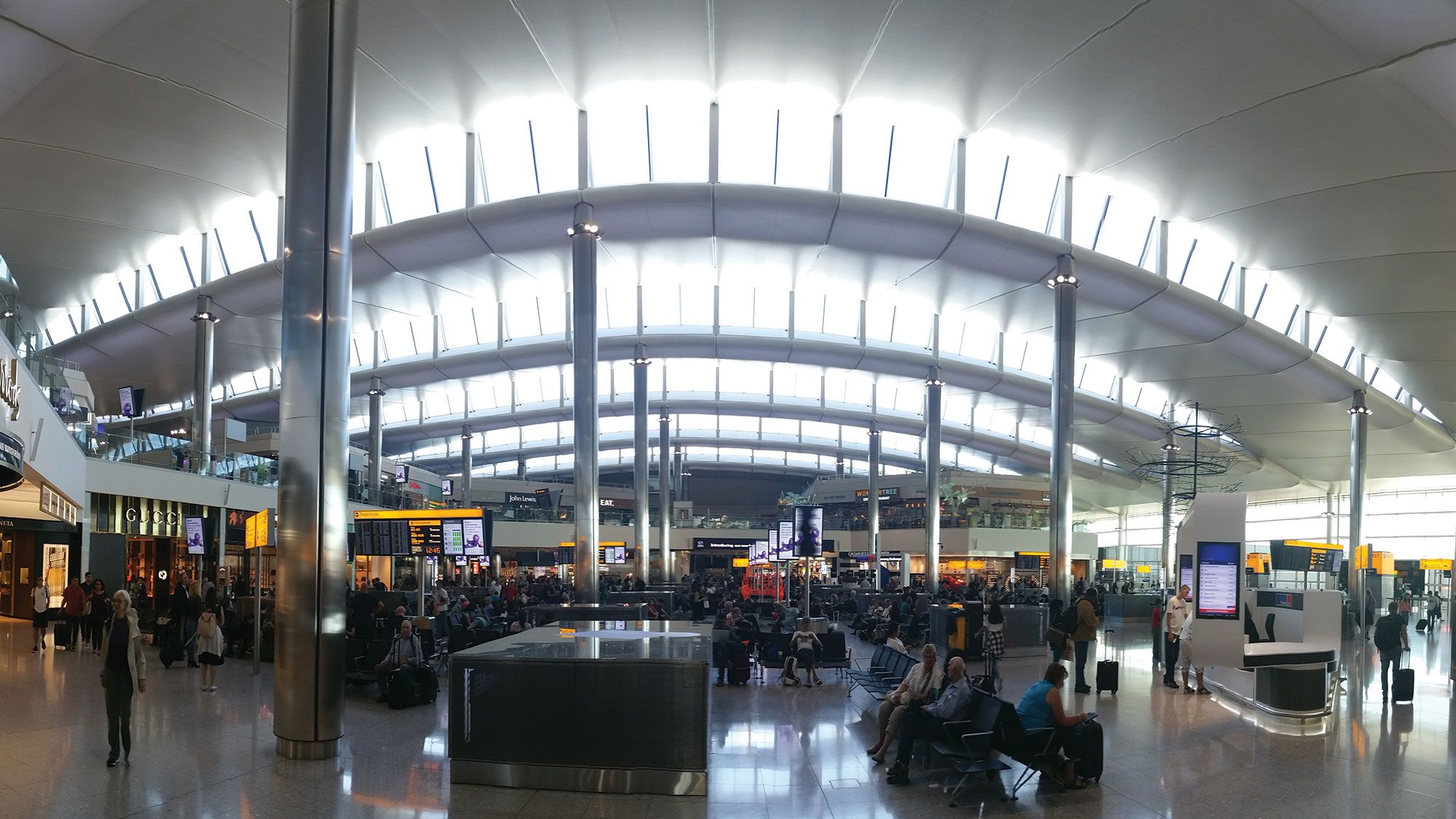 In London Heathrow’s Terminal 2, waves in the roof help make wayfinding intuitive. (Courtesy of Luis Vidal + Architects)