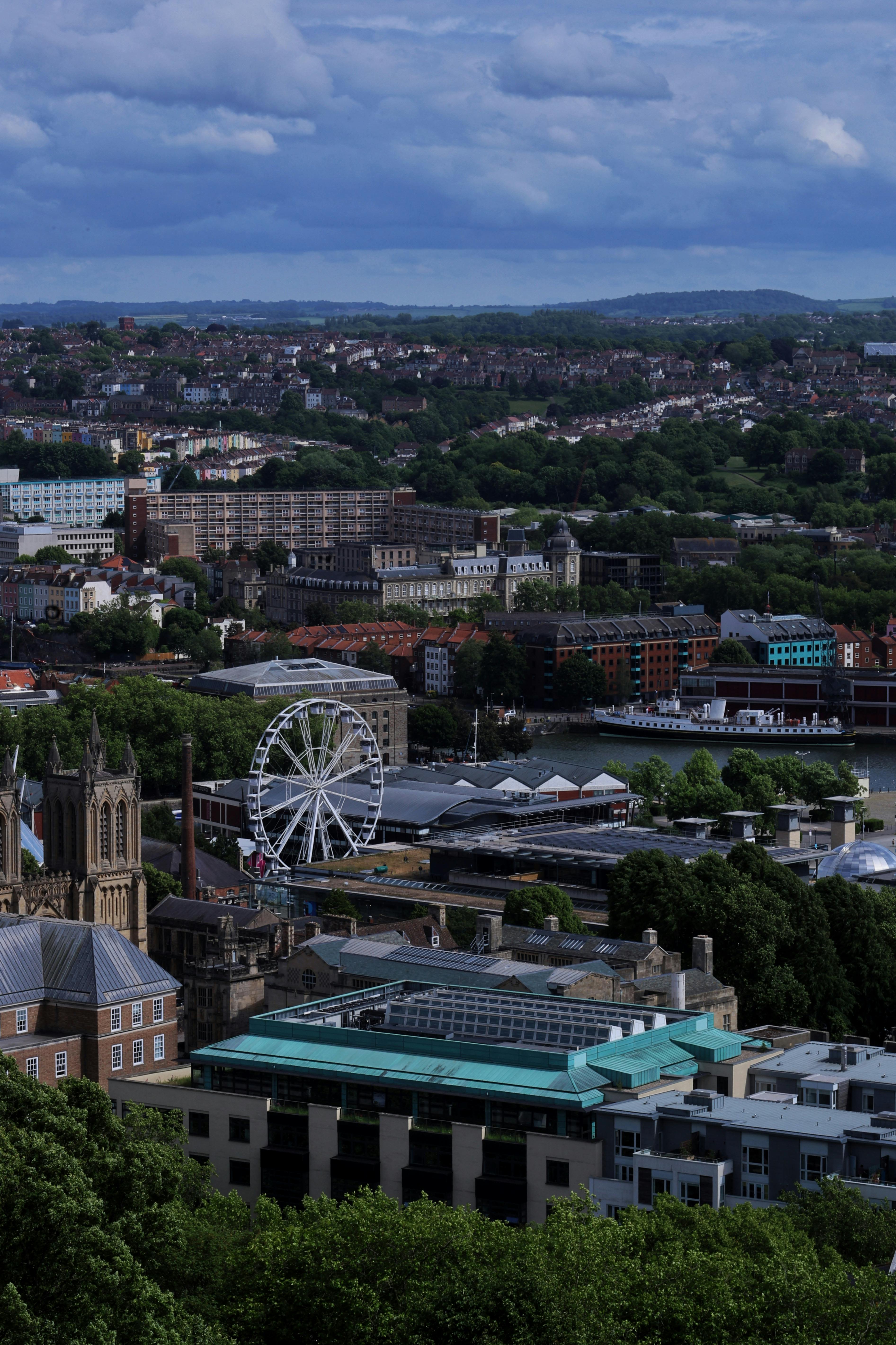 Explore the stunning aerial view of Bristol, showcasing the city's architecture and iconic ferris wheel.