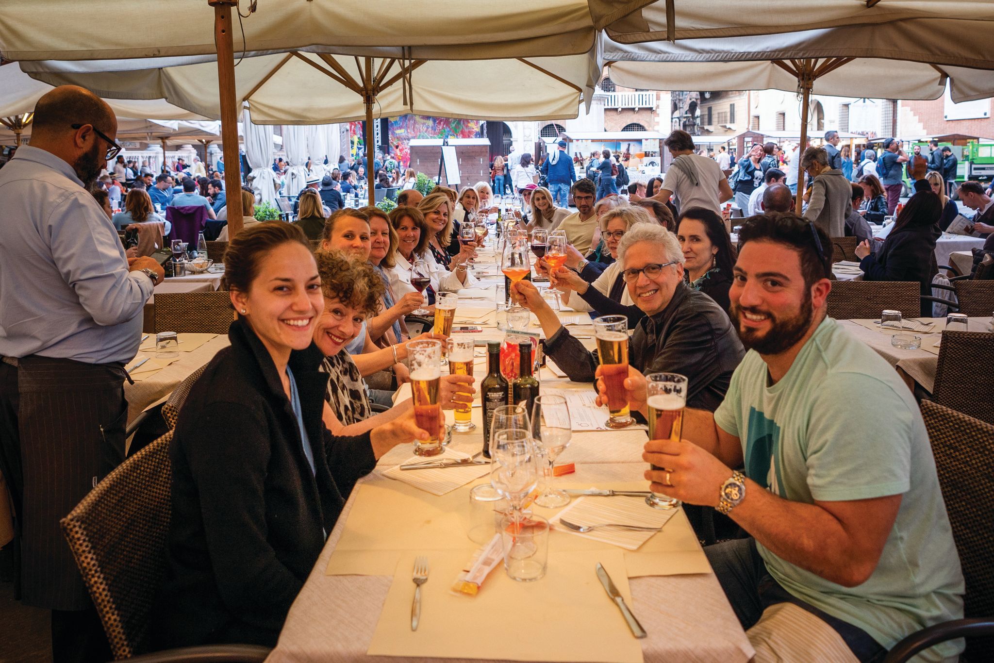 SRV Chef Lombardi, bottom right, and the Oldways tour group eating at Pizzeria Impero in the heart of Verona, Italy.