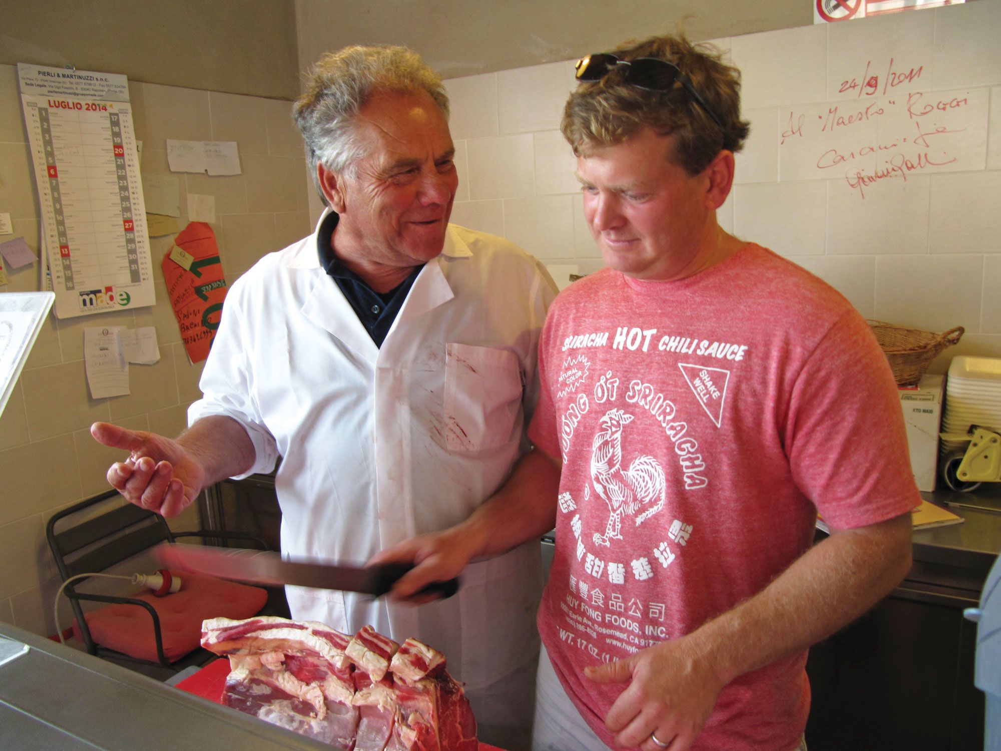 Josh Ziskin, right, chef and co-owner of La Morra, and a local butcher on a DuVine tour of Tuscany.