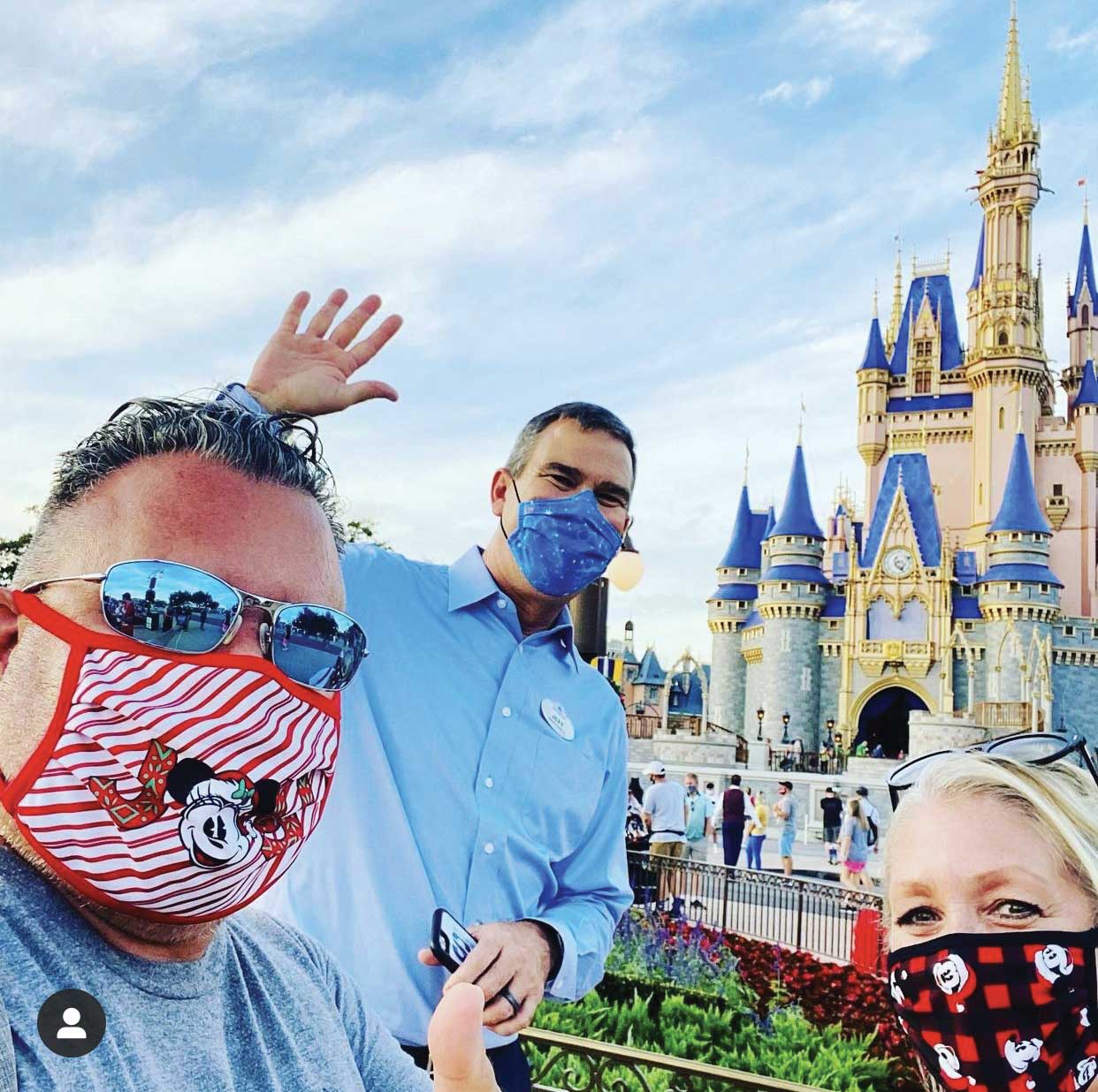 Greg and Elyssa Antonelle, owners of MickeyTravels in Windermere, Fla., with Walt Disney World Resort president Jeff Vahle in the Magic Kingdom.
