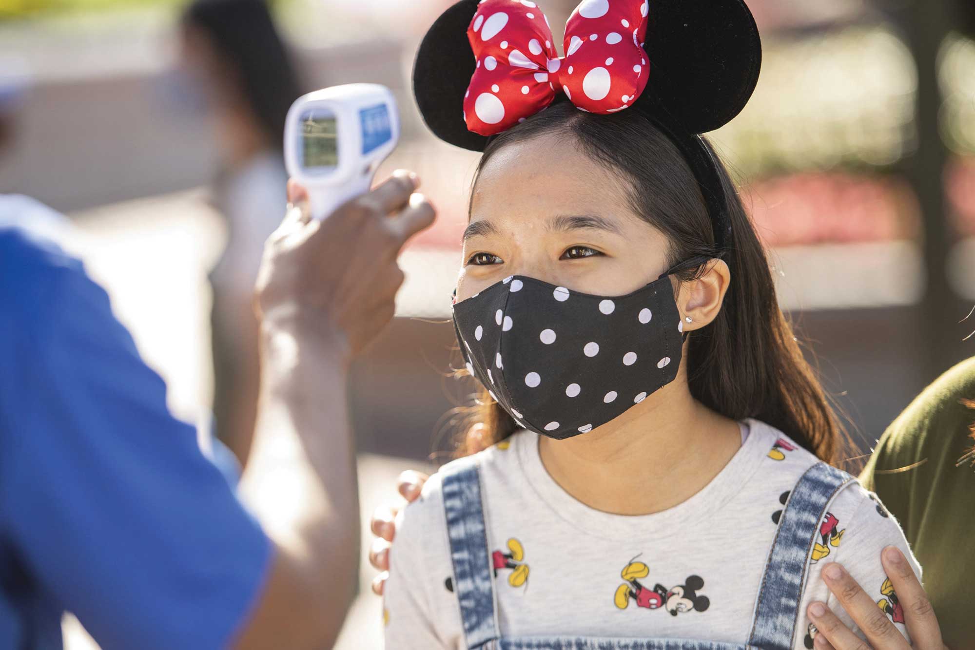 Temperature checks are required for entry into Disney’s theme parks.