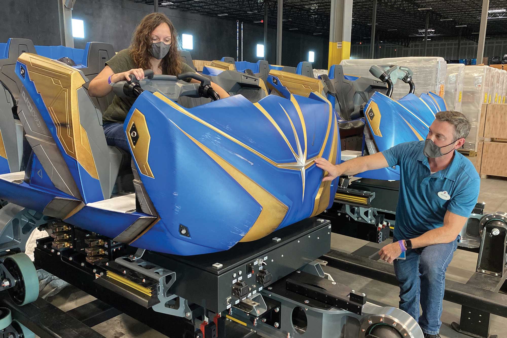 Imagineers inspect vehicles for the upcoming the Guardians of the Galaxy: Cosmic Rewind coaster.