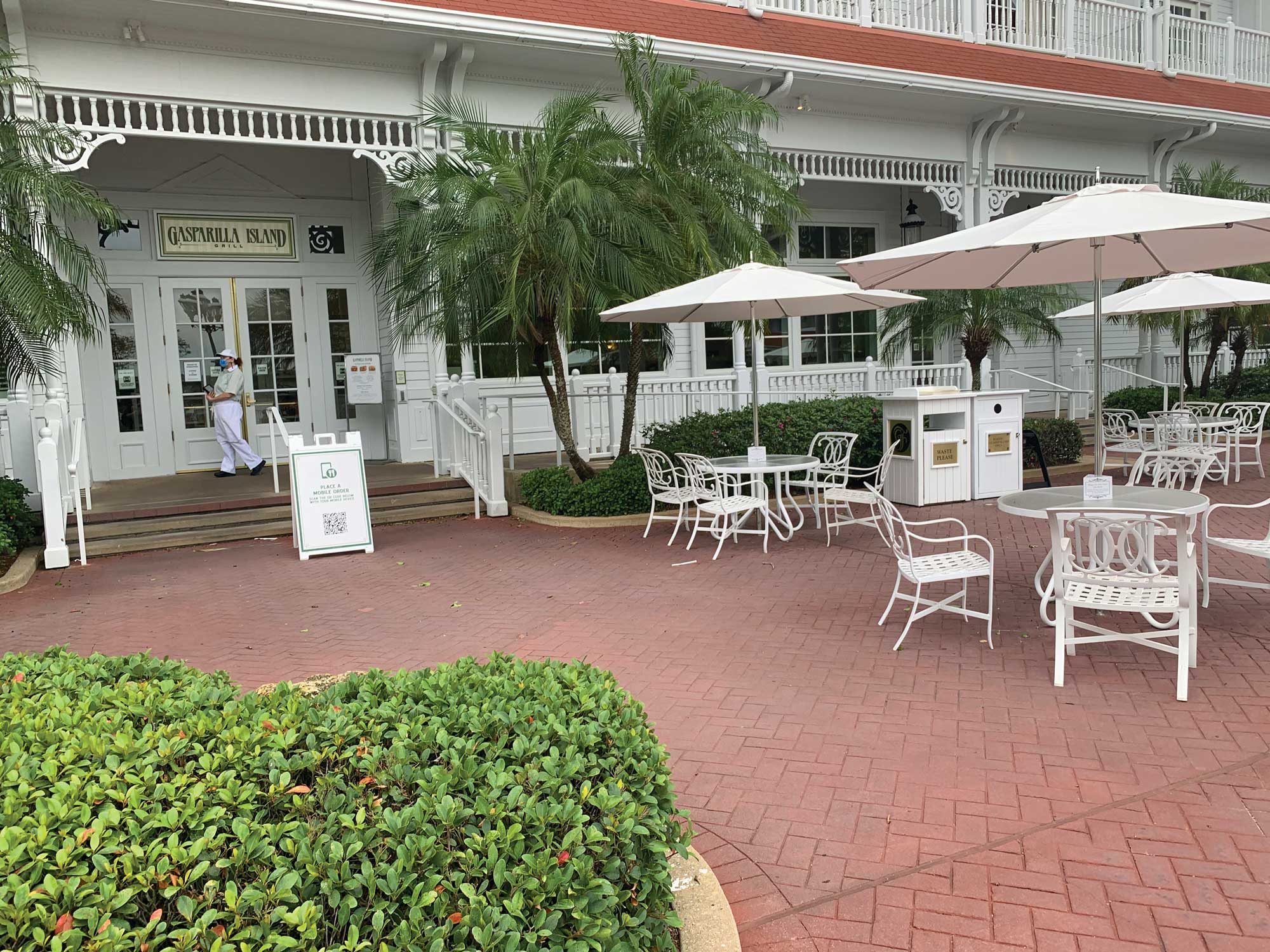 A sign outside Gasparilla Island Grill at the Grand Floridian Resort & Spa has a QR code that directs guests to online ordering. (TW photo by Jamie Biesiada)
