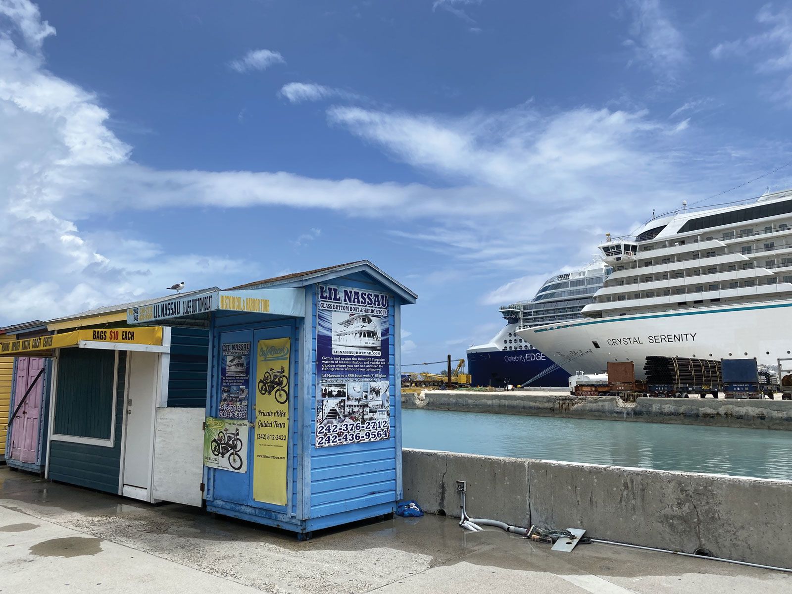 The Celebrity Edge and Crystal Serenity in Nassau on July 2, when most shops near the port were still shuttered but construction was underway on many storefronts. (TW photo by Johanna Jainchill)