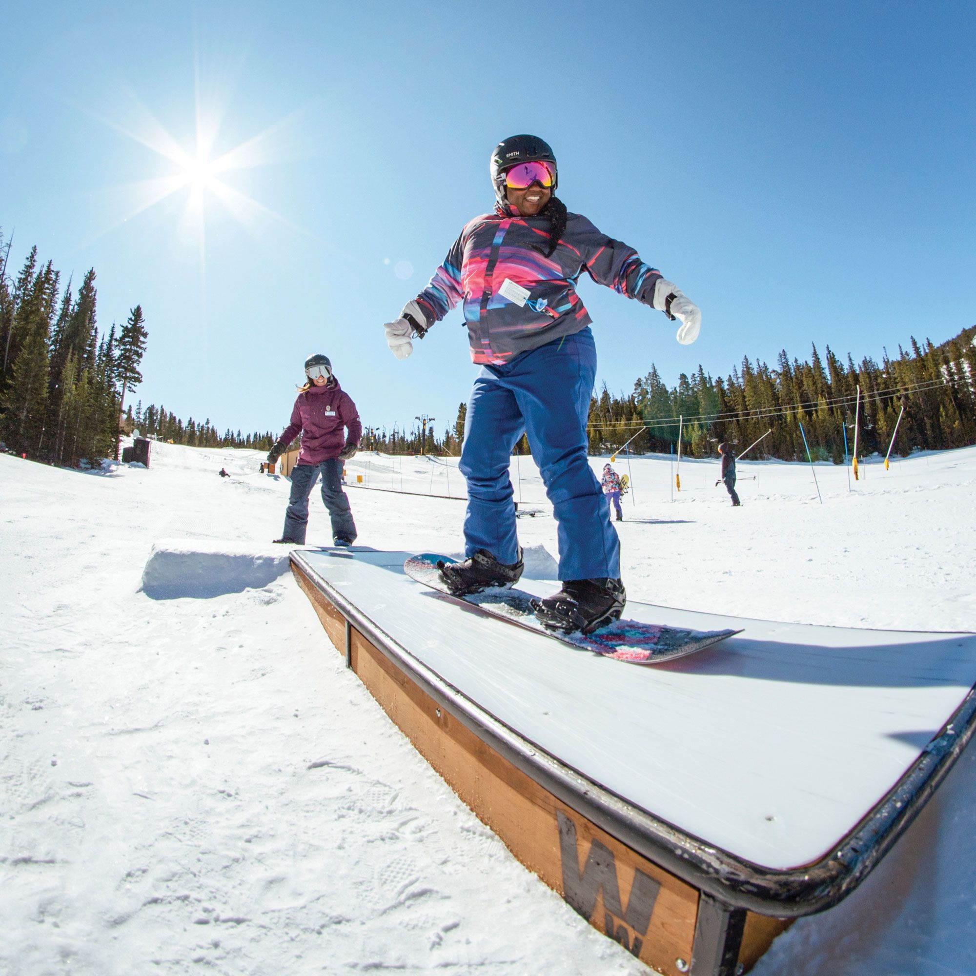 Women of Winter provides scholarships for women of color to earn certification as ski instructors. Here, a program participant works on her snowboarding terrain park skills at Colorado’s Eldora ski area. (Courtesy of Women of Winter)
