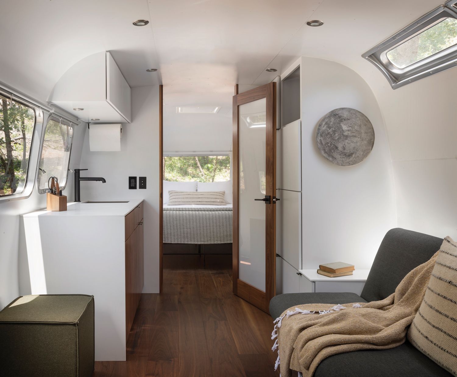 The interior of an AutoCamp Airstream travel trailer accommodation.