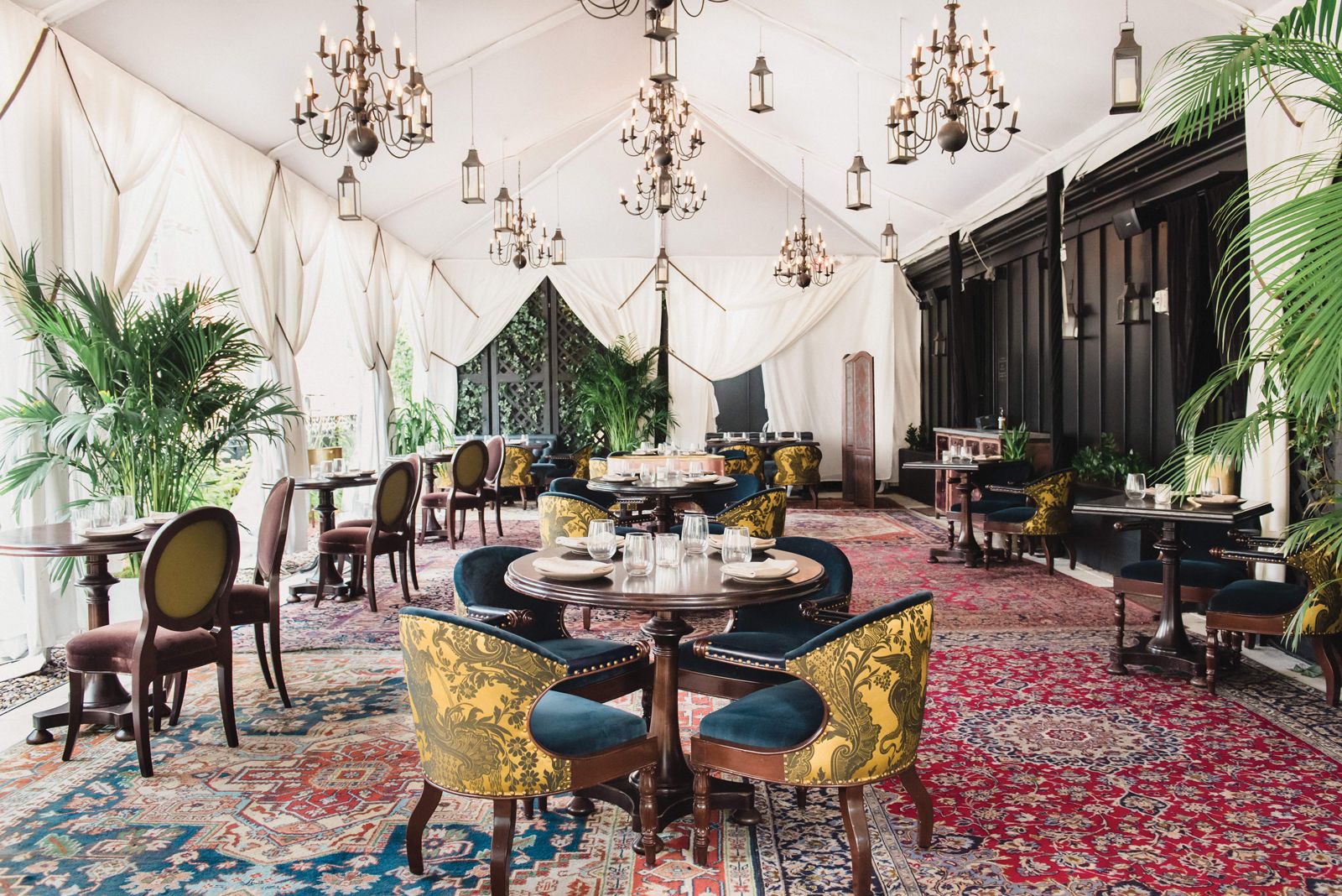 A tent and heaters keep diners warm and dry in the open-air rooftop dining venue at the NoMad New York.