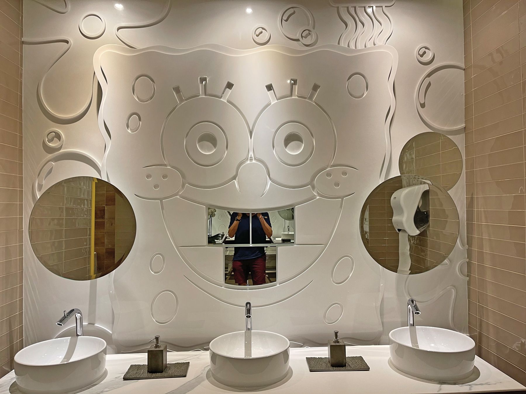 …and here he is again, adorning the backsplash of a lobby restroom.