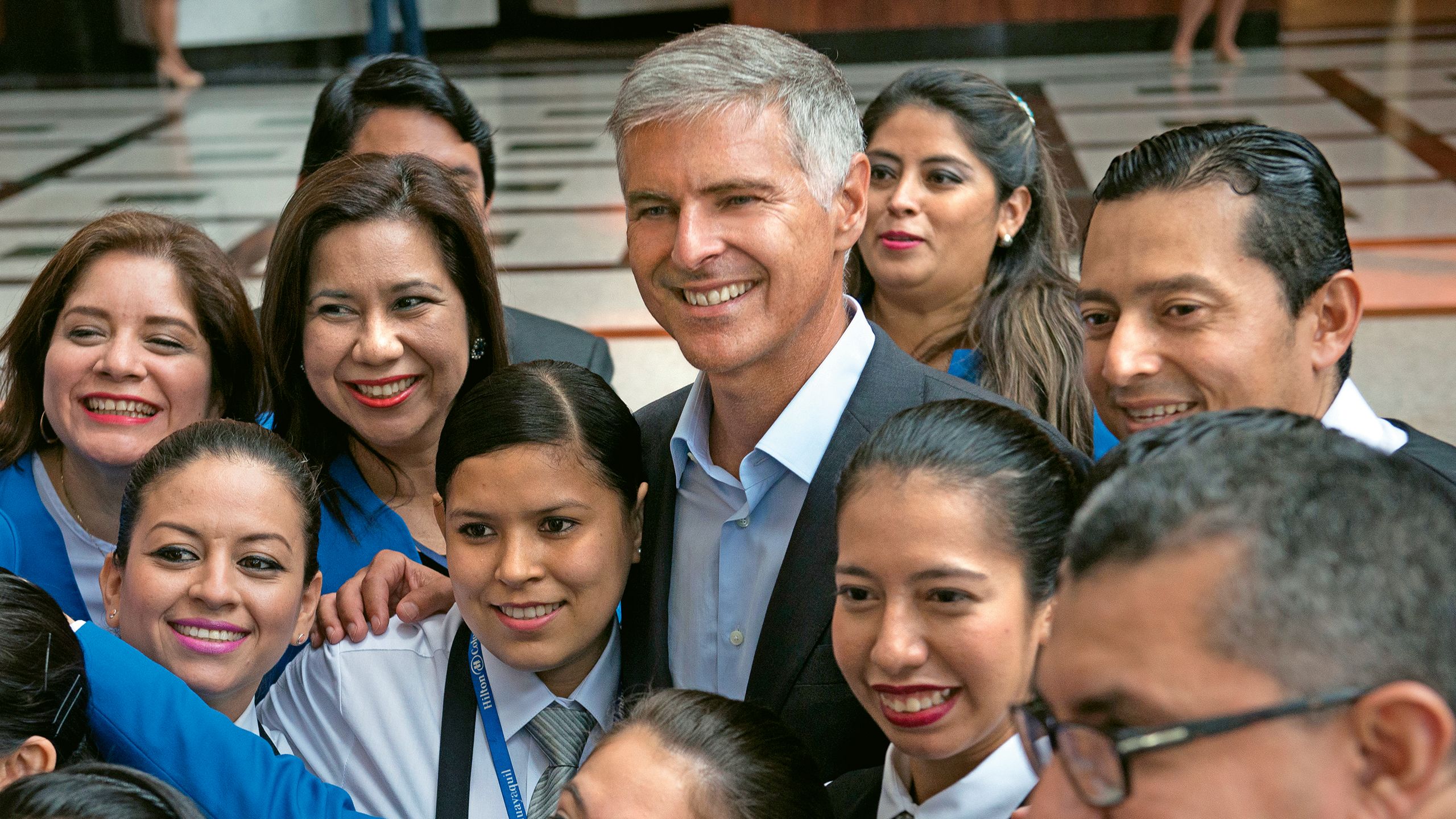 Hilton CEO Chris Nassetta with staff at the Hilton Colon Guayaquil in Ecuador. He poses this question to intermediaries: “How do we do business with you that isn’t just paying you for what we can do but is paying you for something that you do that’s unique?”