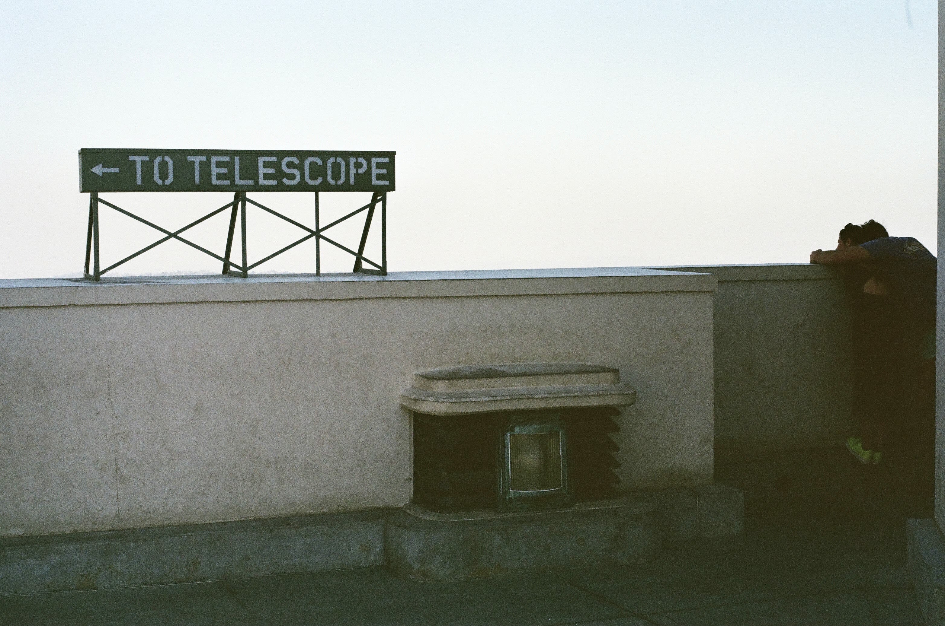white concrete wall with black and white signage