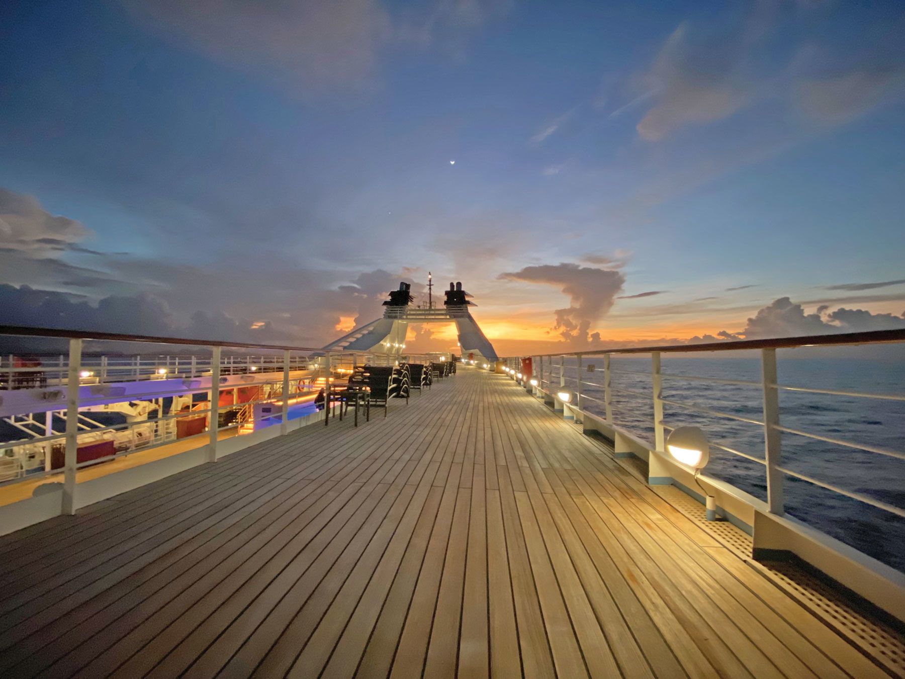 The sun rises behind the Star Breeze as it sails toward Moorea. (TW photo by Andrea Zelinski)