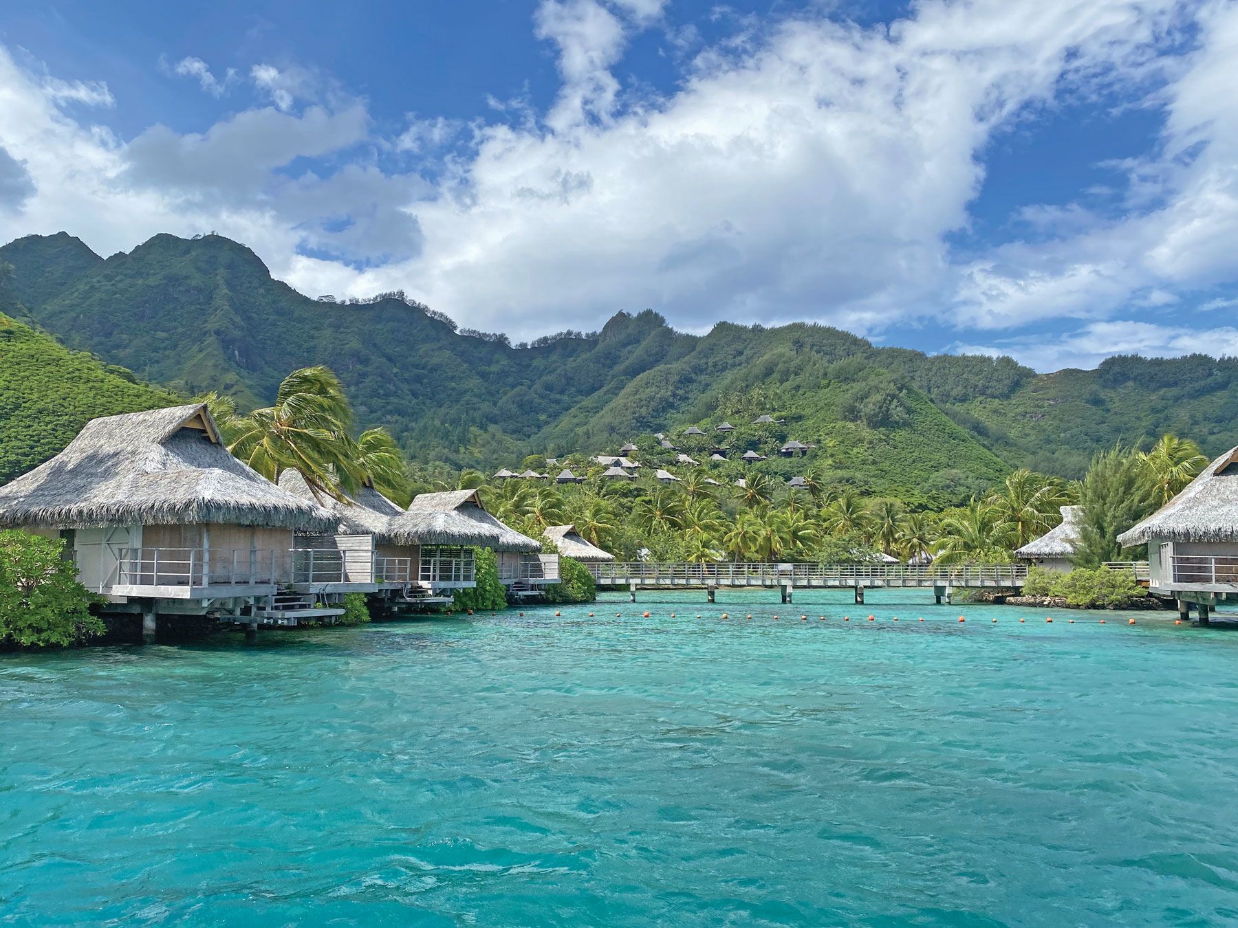 Boarded-up overwater bungalows at the closed InterContinental Moorea Resort and Spa. (TW photo by Andrea Zelinski)
