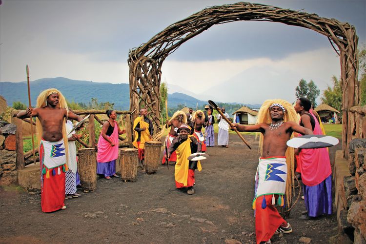 Dancers and drummers greet the president, Greenberg and crew as they approach Volcanoes National Park. 