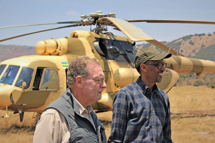 CBS News travel editor Peter Greenberg and Rwandan president Paul Kagame arrive by helicopter at Akagera National Park.