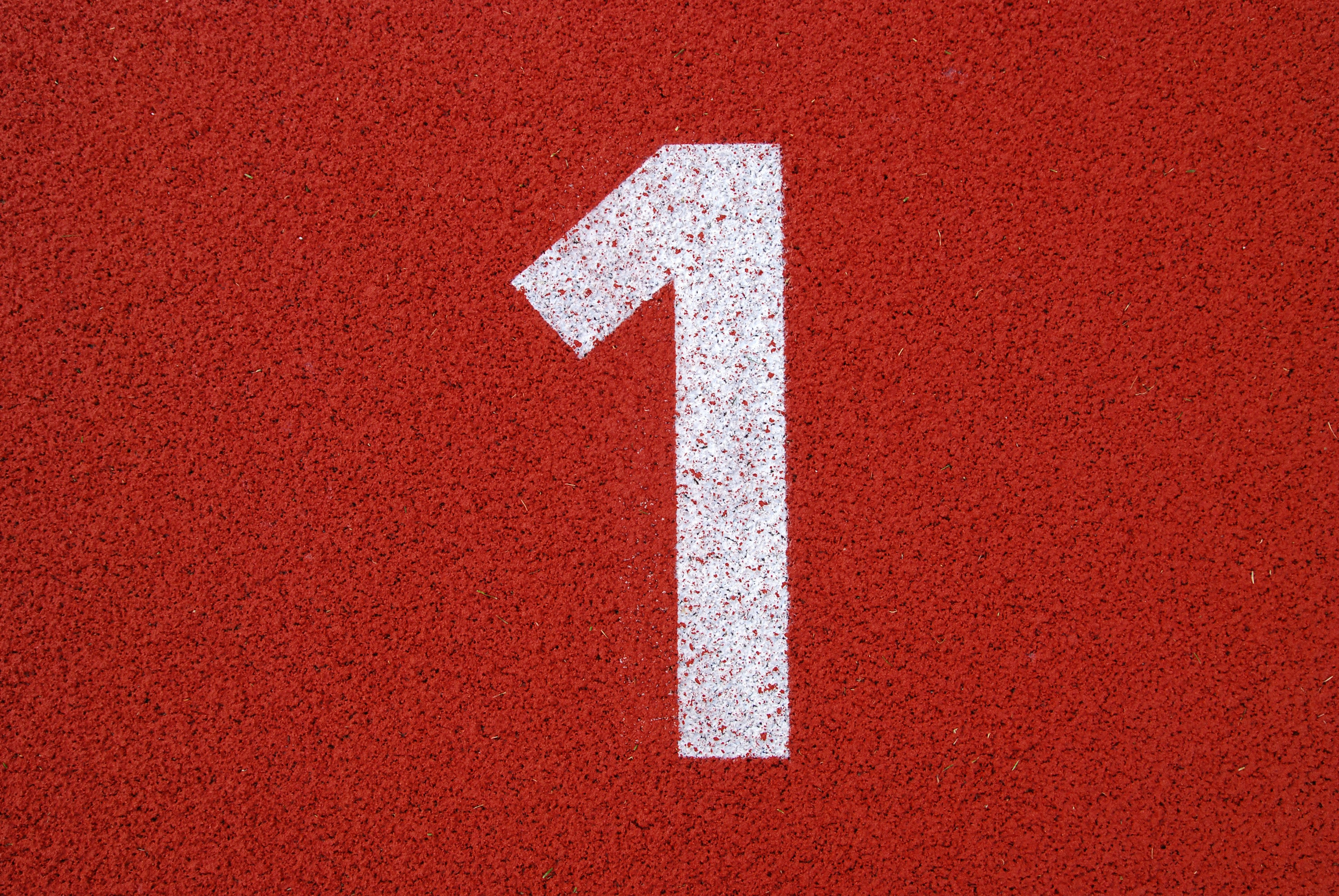 white and red arrow sign