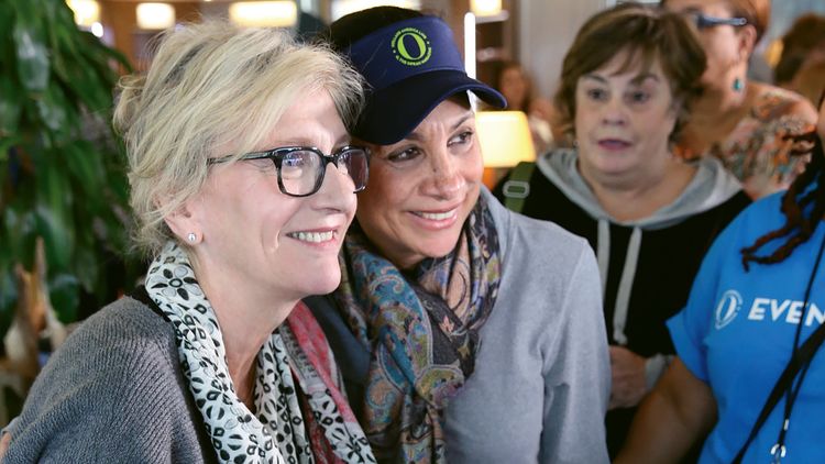 Pulitzer Prize-winning author Elizabeth Strout poses with a fan at the O’s Reading Room onboard HAL’s Eurodam. 