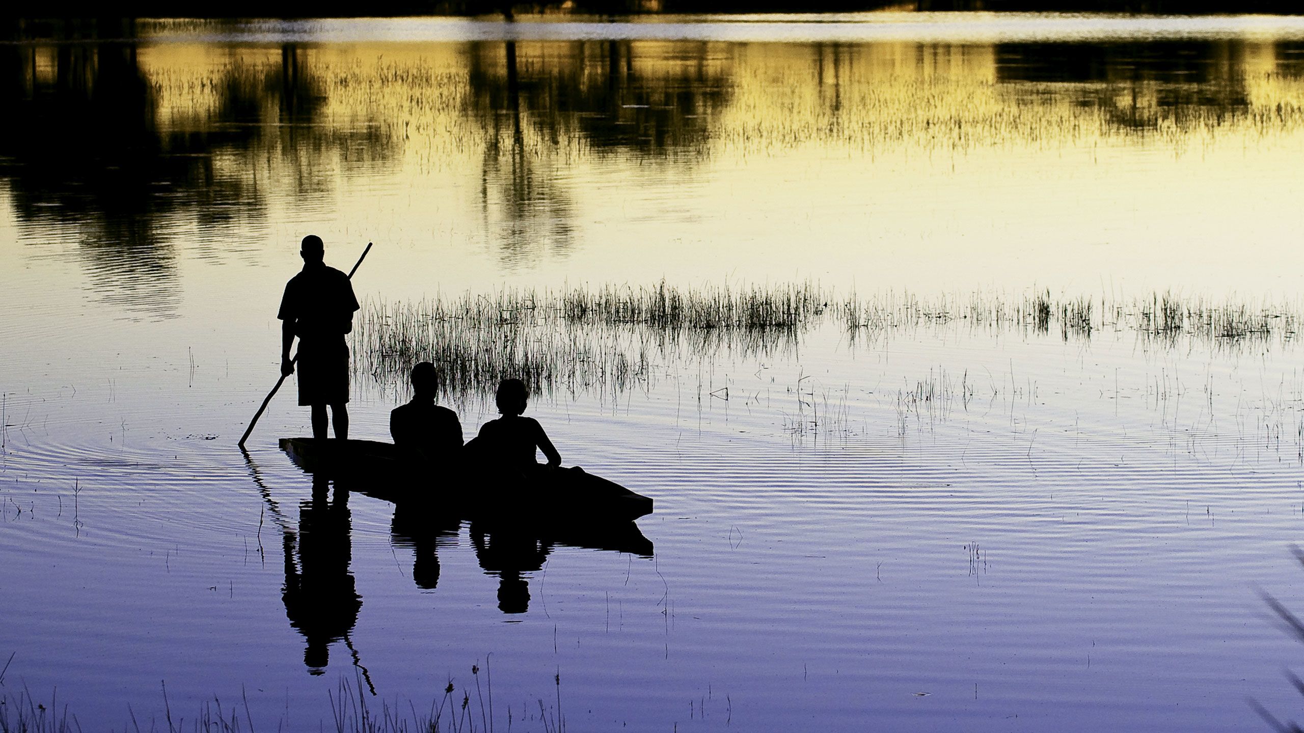 Mokoro at sunset in the Okavango. Photo courtesy of Wilderness Safari/Dana Allan