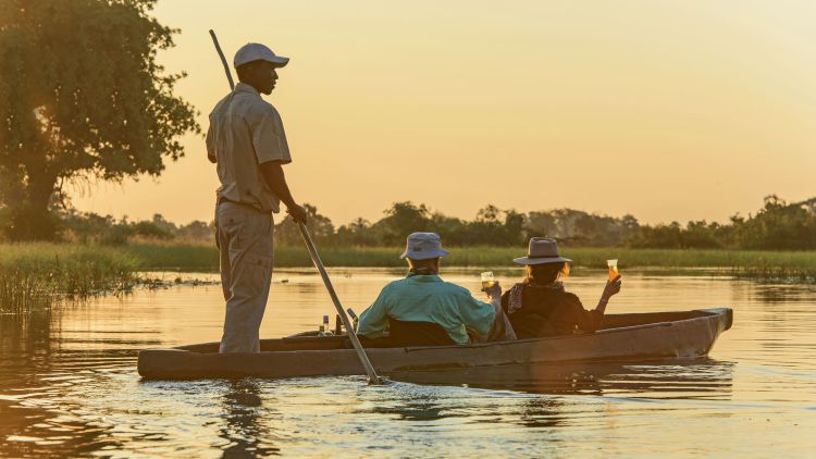 Afternoon sundowner drinks on the Okavango. Photo courtesy of Wilderness Safaris/Mike Myers