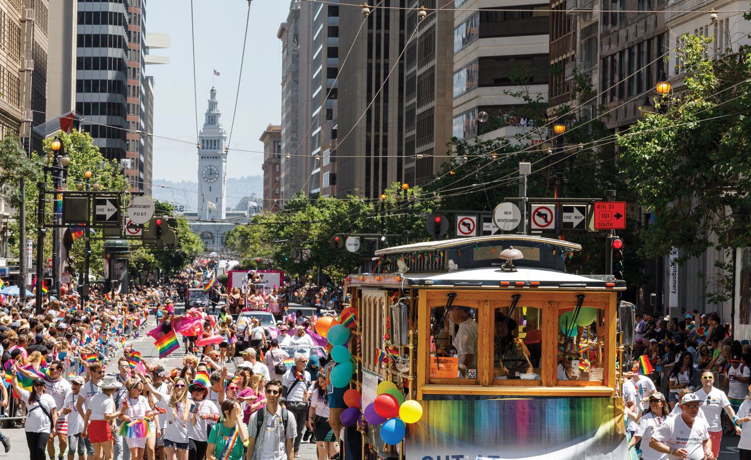 A parade in San Francisco, where Pride visitors bring in hundreds of millions of dollars a year. (Photo by Nader Khouri/SF Travel)