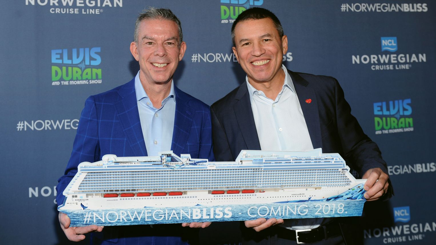 Radio personality and  Norwegian Bliss godfather Elvis Duran, left, holding a cutout of the ship with Norwegian president Andy Stuart.