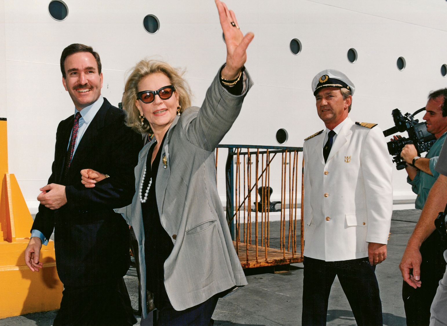 Legendary Hollywood actress Lauren Bacall walks with Royal Caribbean Cruises chairman Richard Fain. Bacall was named godmother of the Monarch of the Seas in 1991.