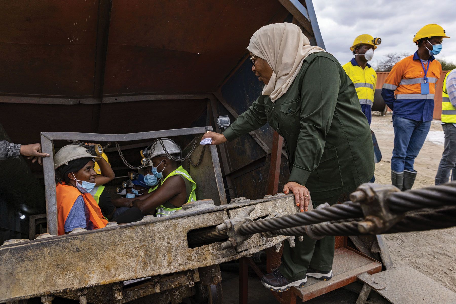 Hassan speaks with miners about to descend three miles below the Earth’s surface in search of tanzanite, a rare gem found only in Tanzania.&nbsp;(Photo by Karen Ballard)