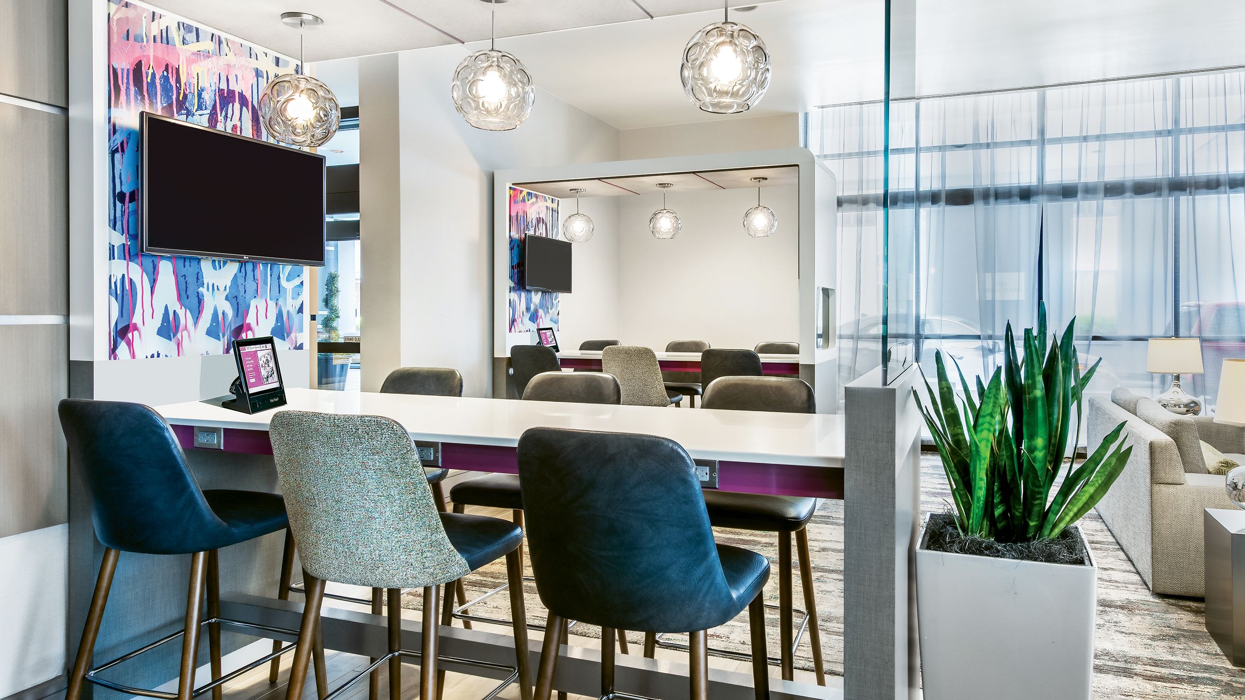 A communal work area at the Plaza Workspace in the Crowne Plaza Atlanta Midtown. InterContinental Hotels Group’s Crowne Plaza began rolling out Plaza Workspace areas in its lobbies in 2017.