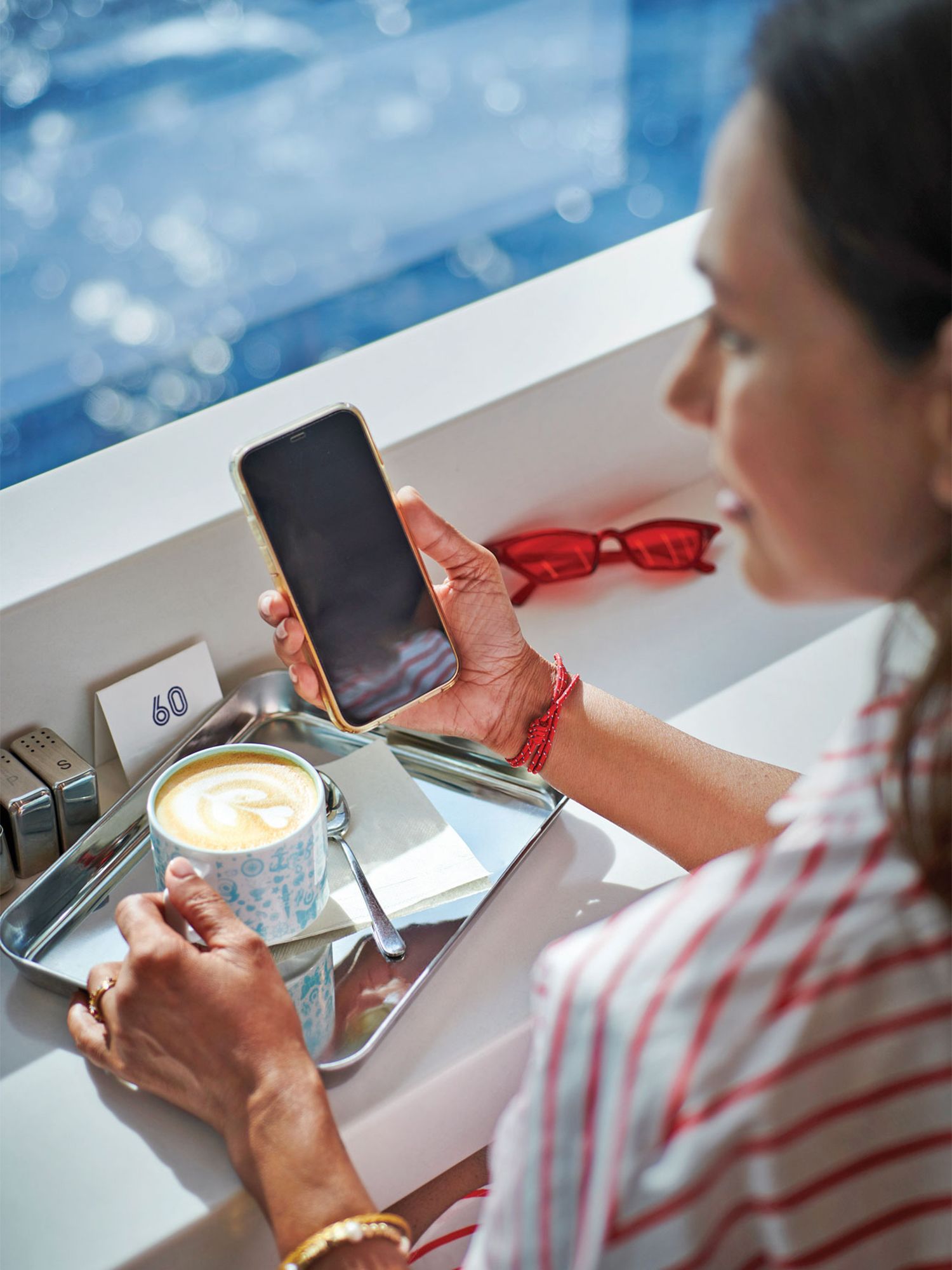 Person using phone on a cruise ship