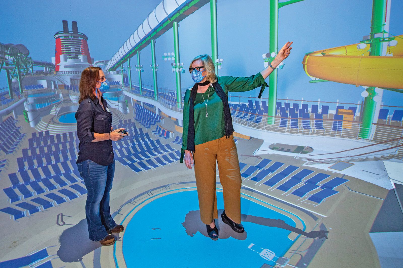 Laura Cabo and an Imagineer in the Digital Immersive Showroom at the Walt Disney Imagineering complex in Florida.