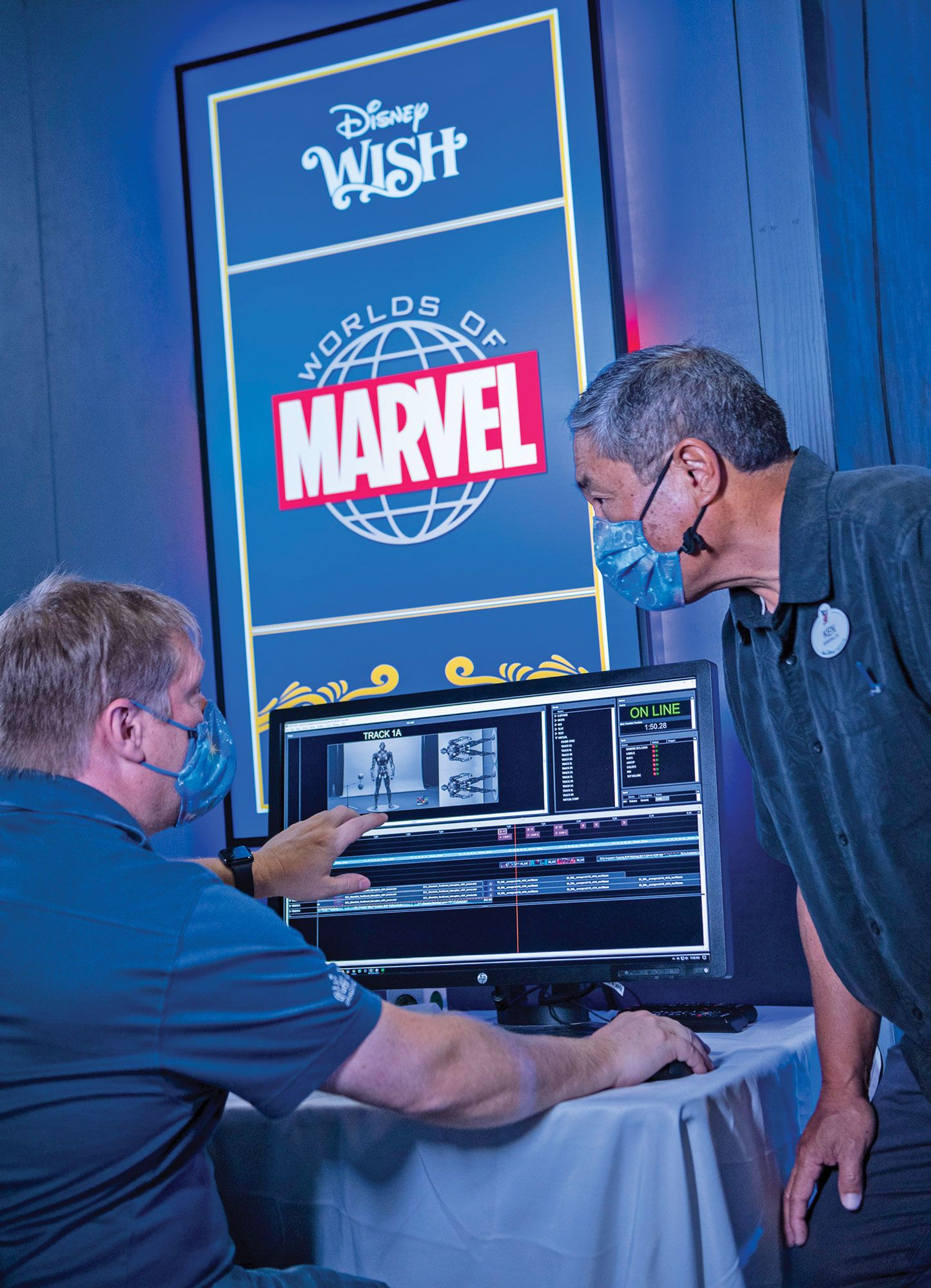 Ken Horii (right), Executive Creative Director, Walt Disney Imagineering, working on the Worlds of Marvel exhibit.