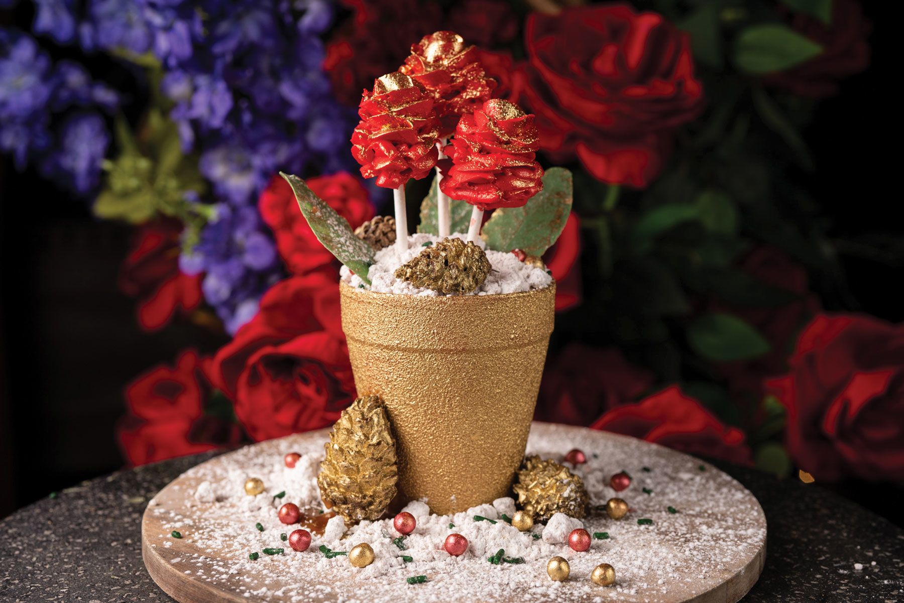 PHD’s “Dream In Roses” Flower Pot Cake has a cream cheese filling white chocolate “soil” and rose-shaped cake pops. (PHD Terrace)
