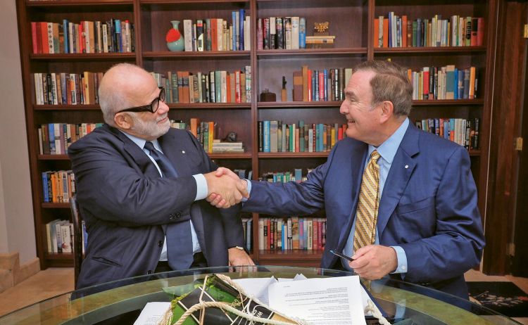 Silversea Cruises chairman Manfredi Lefebvre d’Ovidio, left, and Royal Caribbean Cruises Ltd. chairman and CEO Richard Fain shake hands. RCCL has agreed to acquire 66.7% of Silversea for $1 billion. 