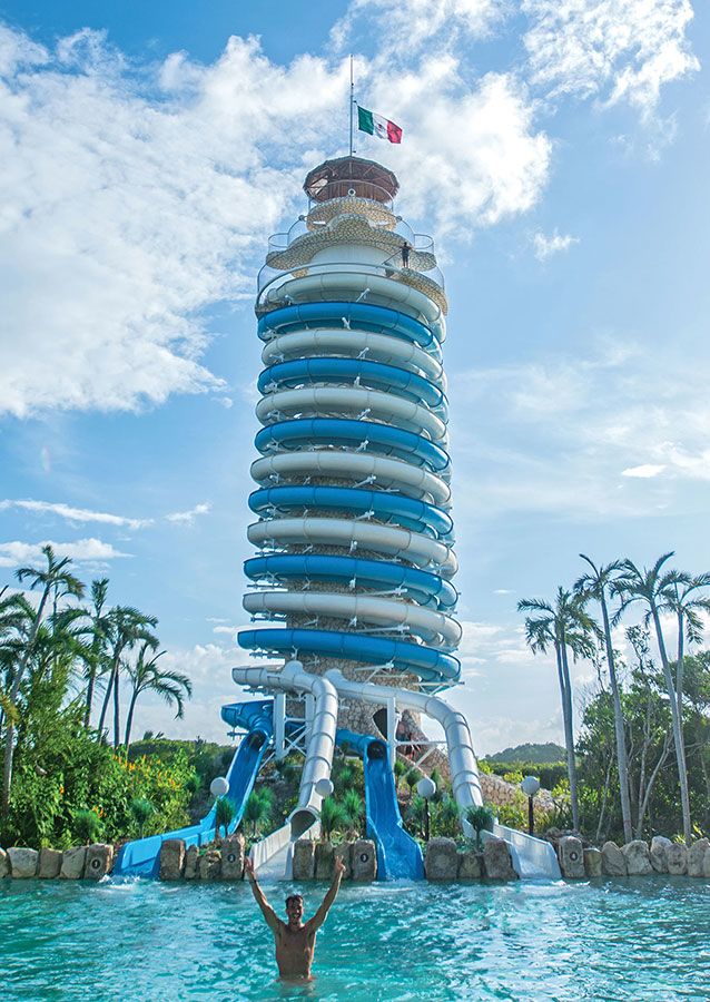 The towering waterslides at another Xcaret ecopark, Xel-Ha, deliver riders into a natural lagoon. 