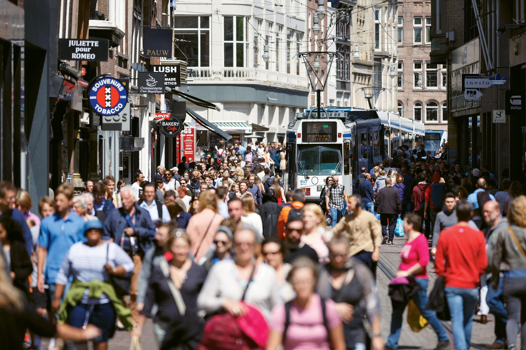 A crowded street in Amsterdam in summer 2016. The city has taken steps to limit daytrippers. (Photo by Konstantin Tronin/Shutterstock.com)
