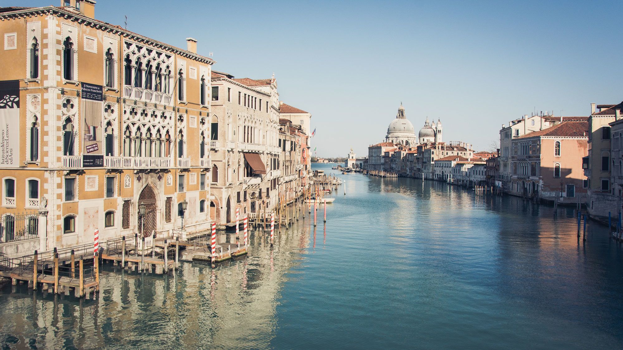 A tranquil Grand Canal from the Accademia bridge in Venice in April. (Photo by govdo/Shutterstock.com)