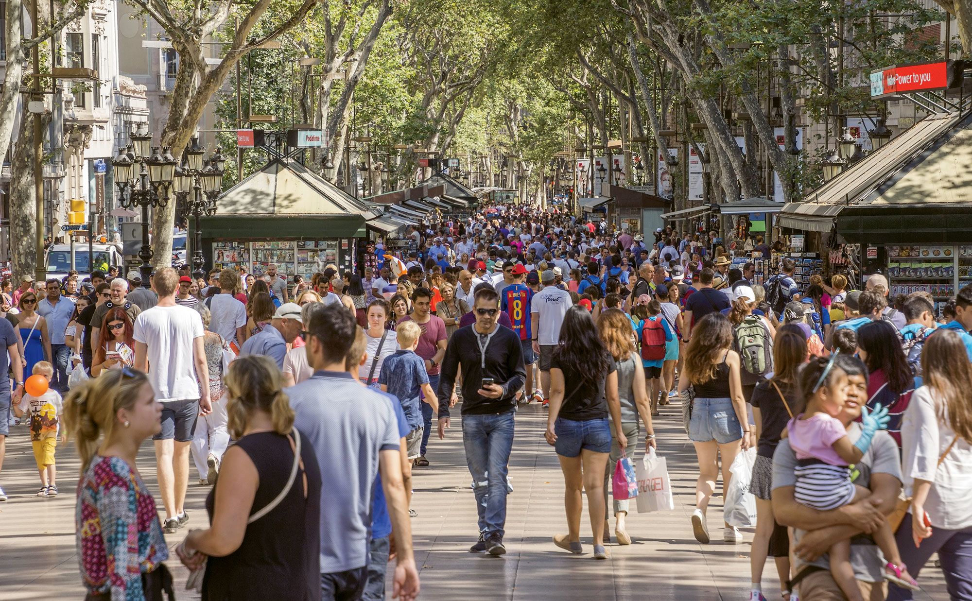 Las Ramblas in summer 2016, with thousands of people promenading. (Photo by Veniamin Kraskov/Shutterstock.com)
