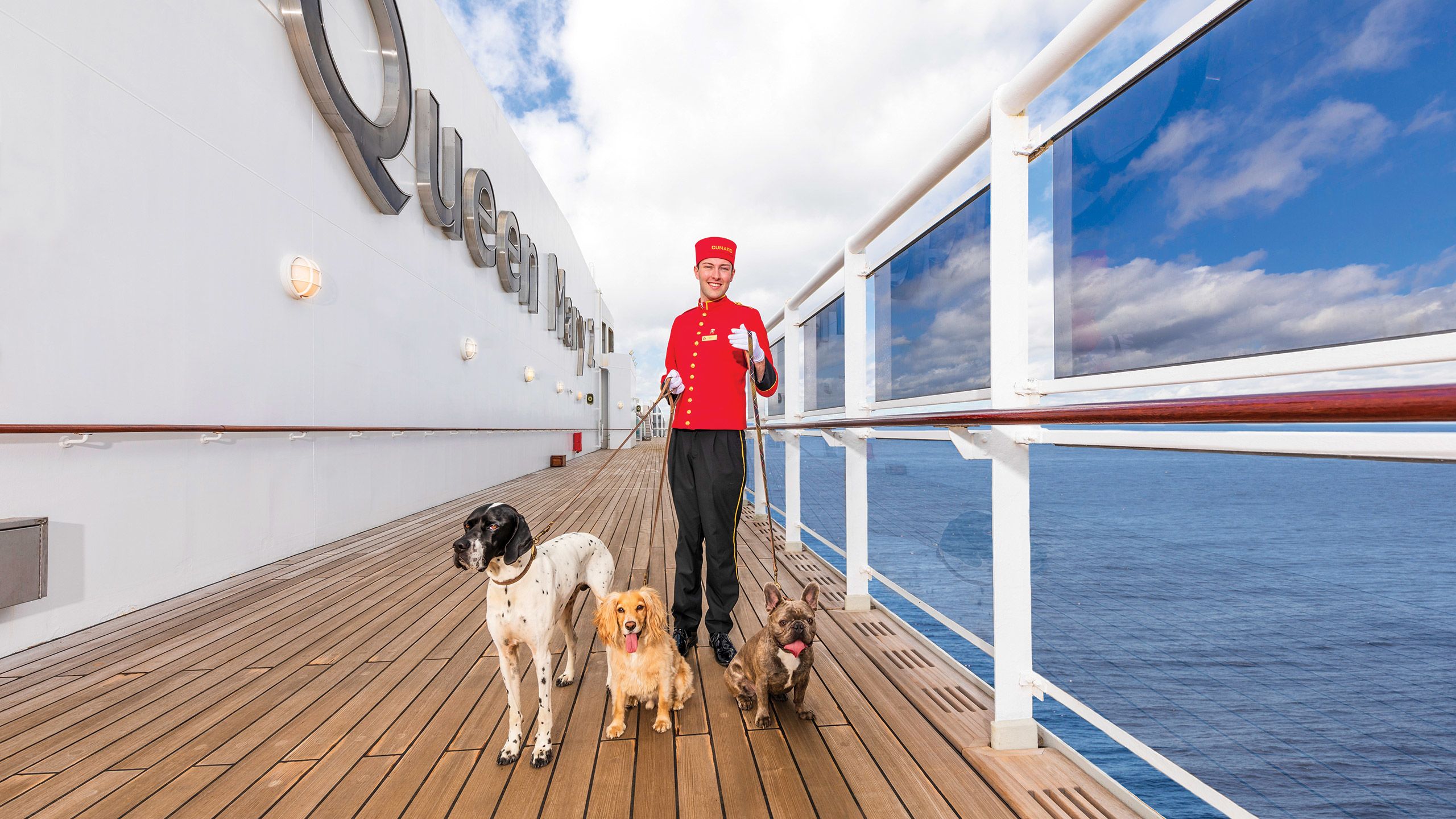 The kennel master walking dogs onboard Cunard’s Queen Mary 2.