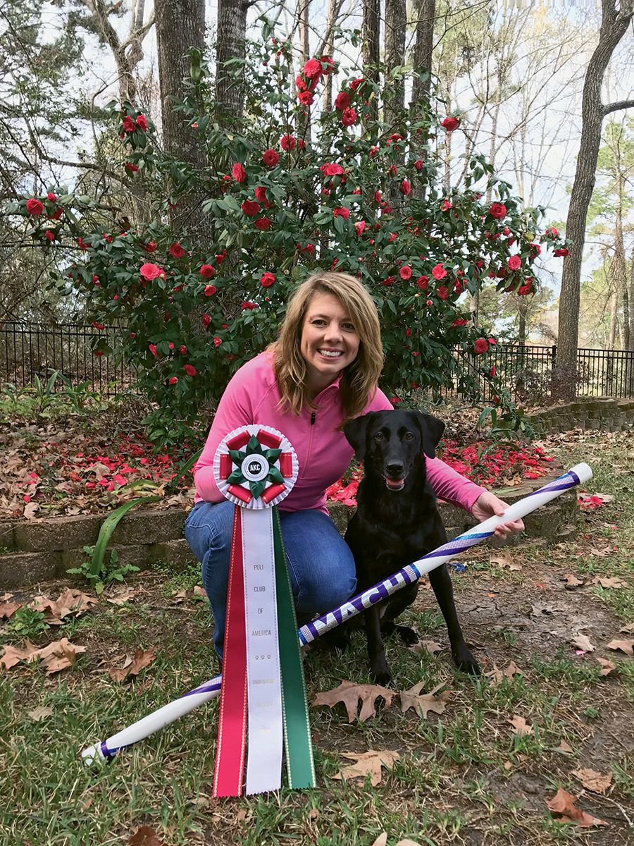 Paula Prickett of Black Dog Luxury Travel with one of her award-winning dogs. Prickett said more properties are going above and beyond for travelers’ pets.