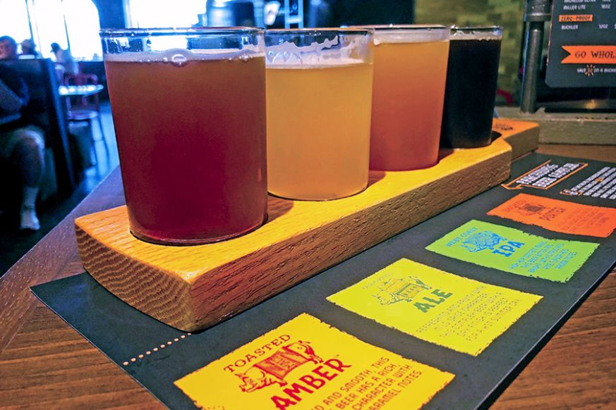 The Guy’s Pig & Anchor Smokehouse/Brewhouse features four Parched Pig brand craft brews meant to compliment the smoky flavors of the barbeque served there.