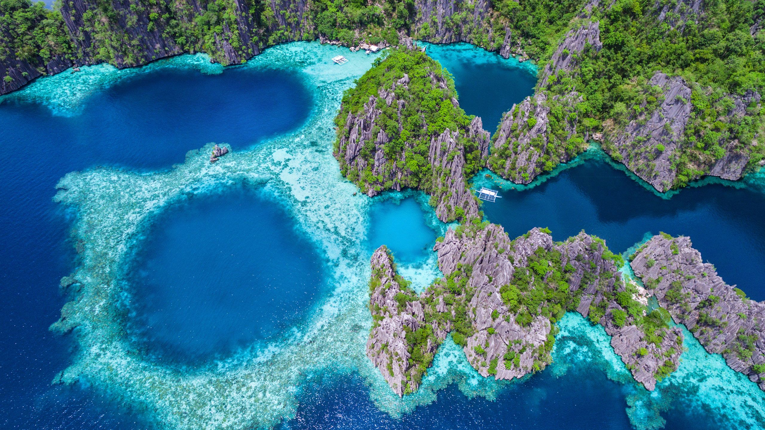 An aerial view of the lagoons and limestone cliffs of Coron, Palawan in the Philippines.
