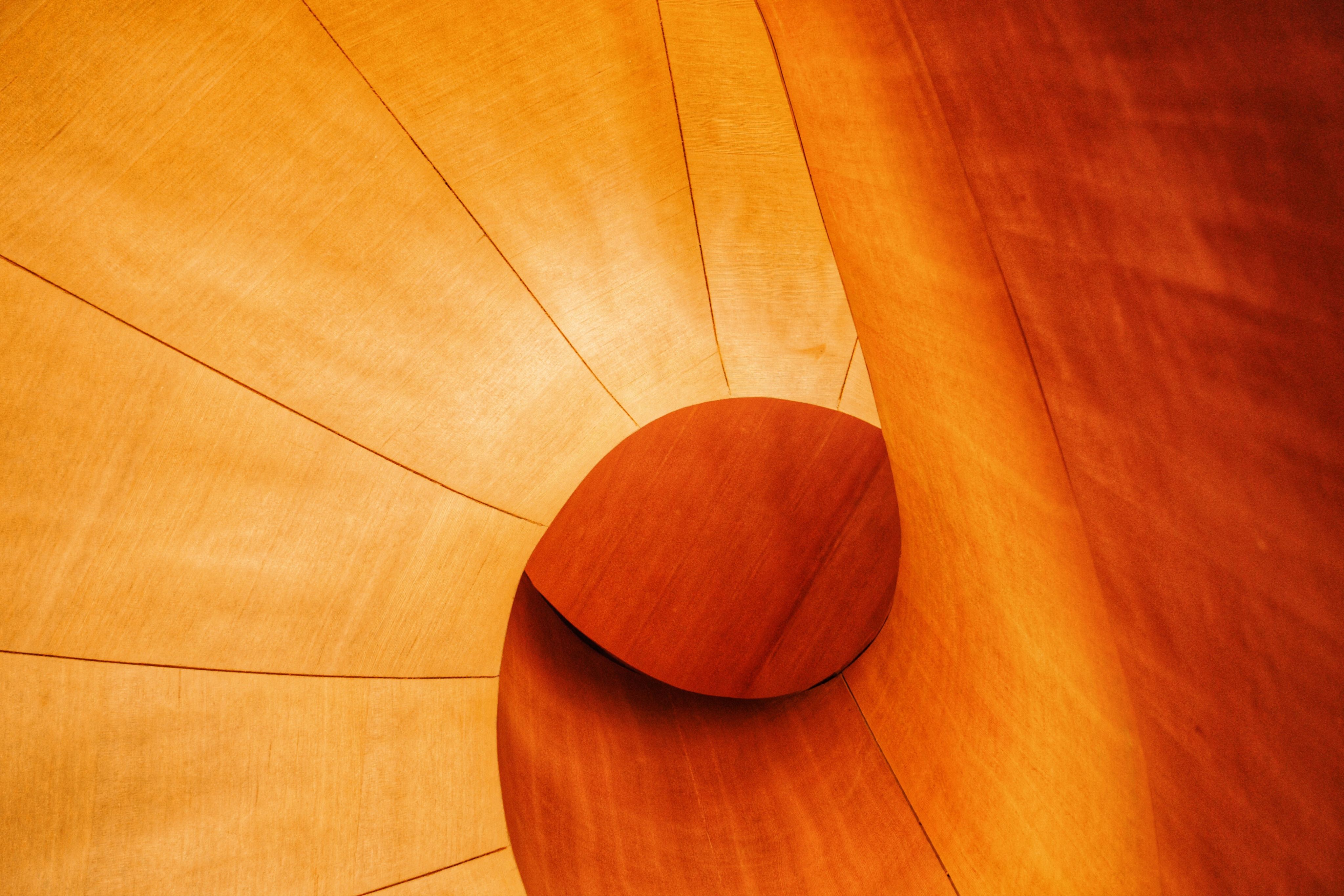 brown wooden round table on brown wooden floor