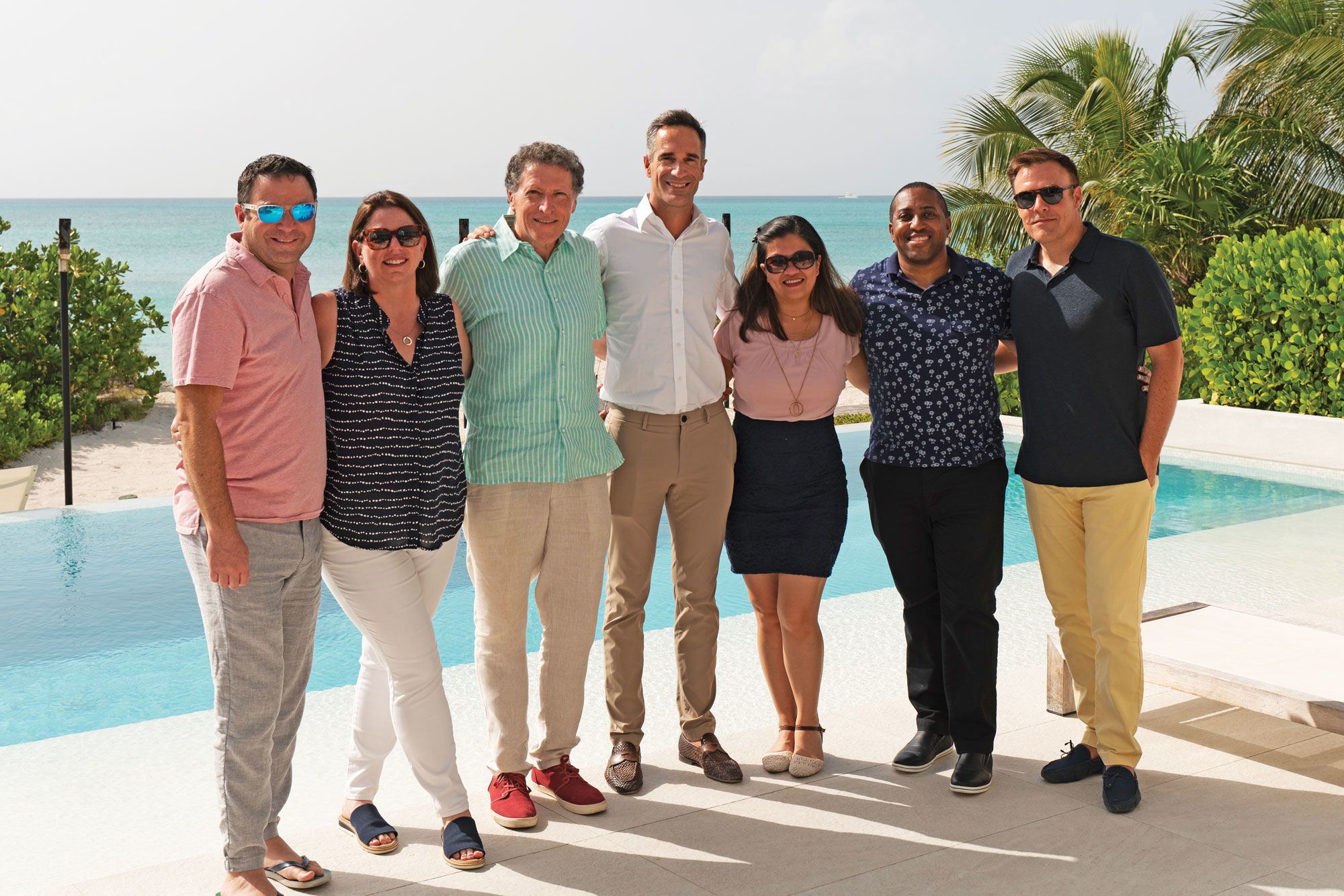 Panelists standing by pool
