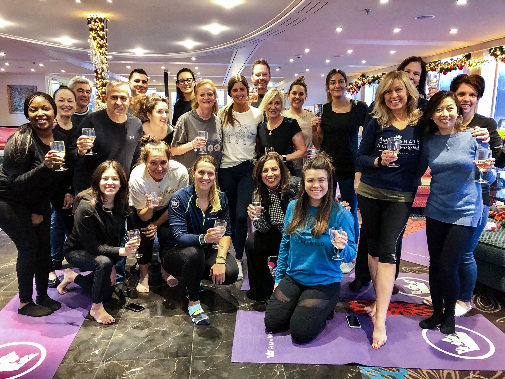 AmaWaterways staff doing a Champagne Yoga class with Selina onboard AmaKristina.