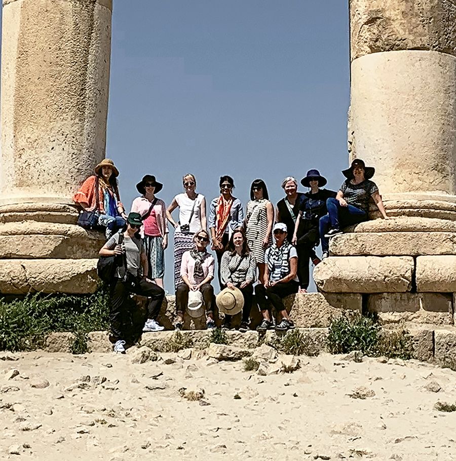 The group of 12 women on the Intrepid trip poses among the ruins of the Temple of Hercules in Amman Citadel, one of the first stops on Intrepid’s women-only expedition in Jordan. Photo by Nuwar Jodeh