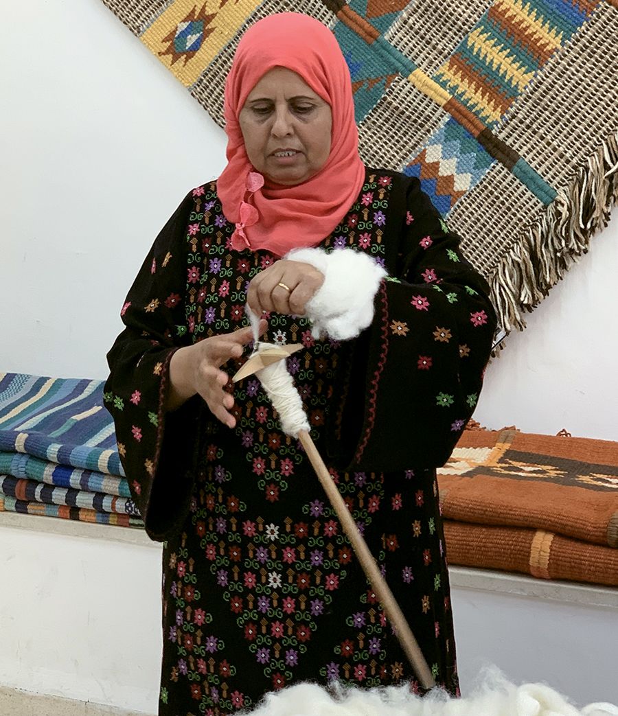 Halima Al Qaydeh, one of the founders of the Jordan River Foundation women’s weaving co-op, demonstrates traditional techniques. TW photo by Jeri Clausing