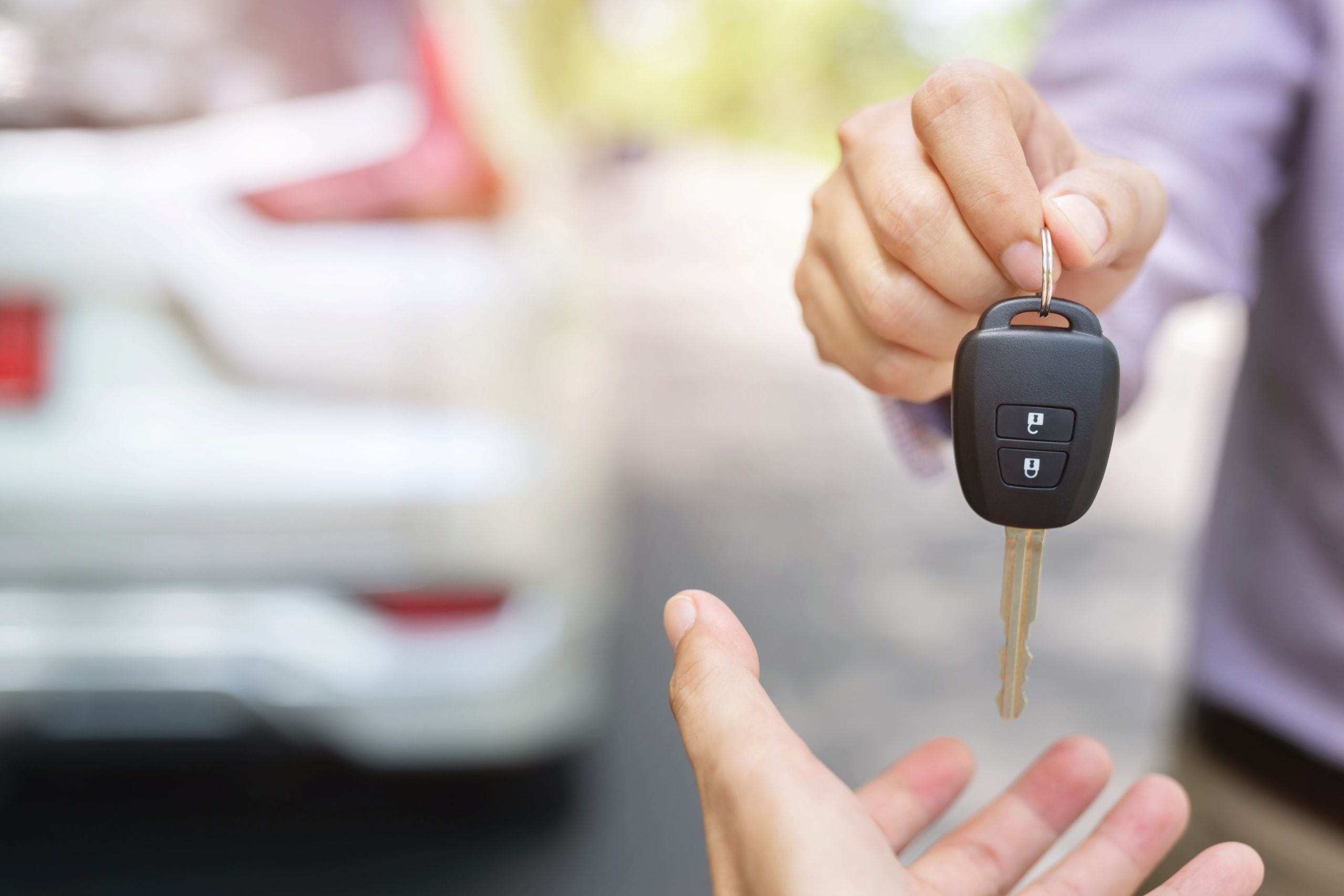 Man handing over keys