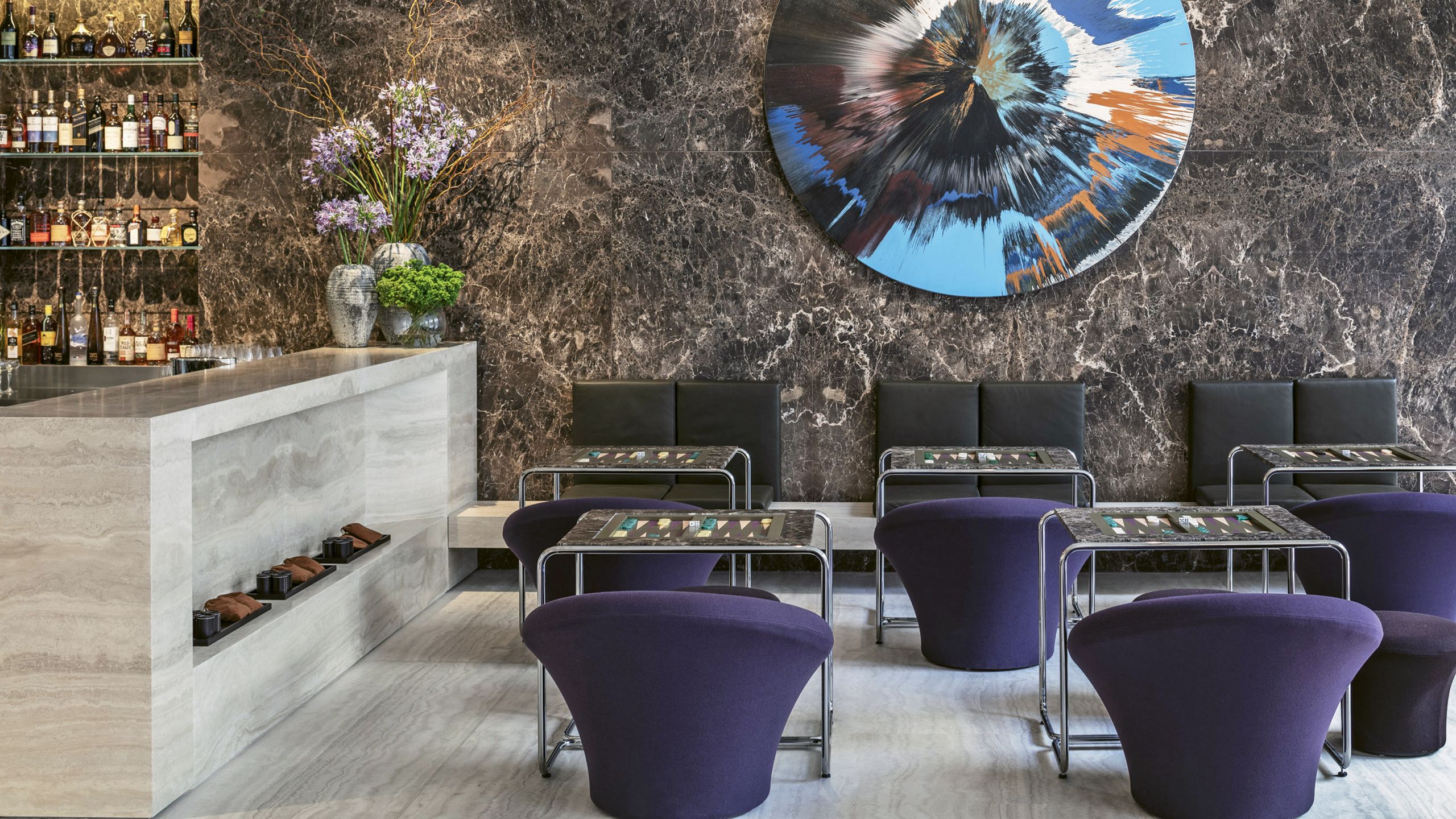 The lobby of the Jaffa, a Luxury Collection Hotel, features a Damien Hirst painting and backgammon tables. Photo by Amit Geron